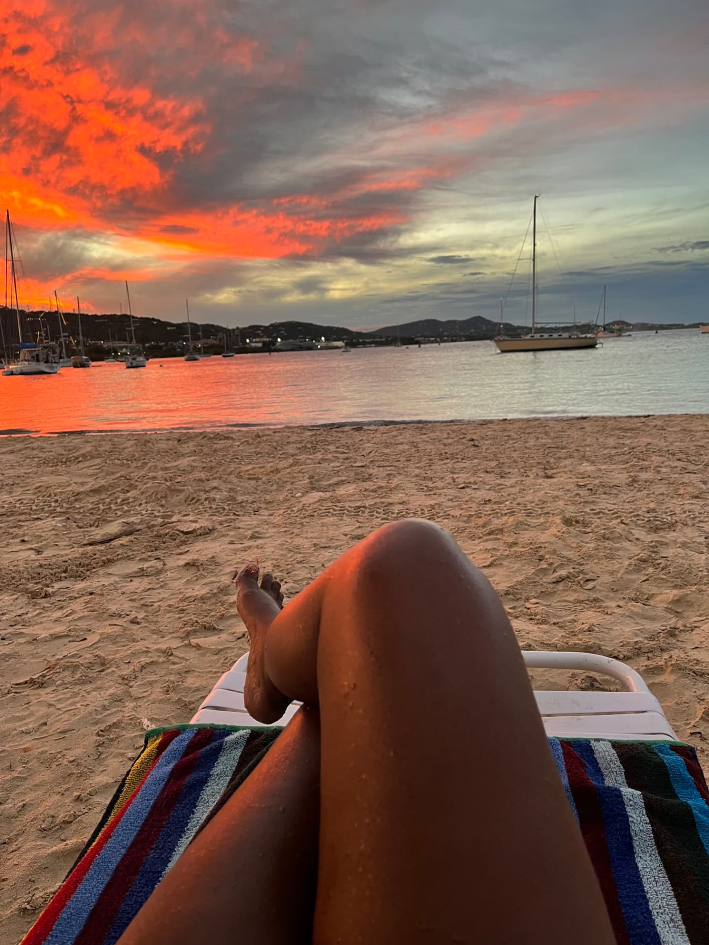 Aly relaxing on the beach at sunset